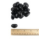 Jumbo black licorice jelly beans, rich spicy anise flavor, approx. 80 per pound, striking black color.