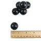 Bulk black gumballs, tutti frutti flavor, versatile for candy buffets, displays, and Halloween decorations.