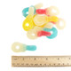 Vibrant pacifier-shaped gummy candy, soft chew, strawberry, raspberry, pineapple flavors. Red, blue, yellow bulk gummies.