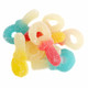 Vibrant pacifier-shaped gummy candy. Red, yellow, blue. Strawberry, raspberry, pineapple flavors, bulk.