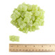 Pile of green Gin & Tonic Gummy Bears, chewy, non-alcoholic, with bright citrus and botanical cocktail flavors.