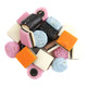Vibrant Gustaf's English Style Licorice Allsorts, assorted black, pink, yellow, white, and green candies with fondant, fruit, and coconut.