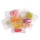 A bulk pile of colorful, individually wrapped Roses Brands Natural Assorted Flavor Barrel hard candies in clear twist-wrappers