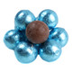 A close-up view of an Albert's light blue foil-wrapped chocolate ball sitting next to an unwrapped milk chocolate ball
