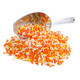 A metal spoon scooping a mix of yellow, orange, and white Candy Corn sprinkles