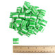 Green and white striped mint pillow mints with a ruler to show size.