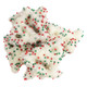 White yogurt covered Christmas tree pretzels, red and green nonpareils. 