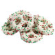 White yogurt covered pretzels, drizzled with red and green nonpareils. 