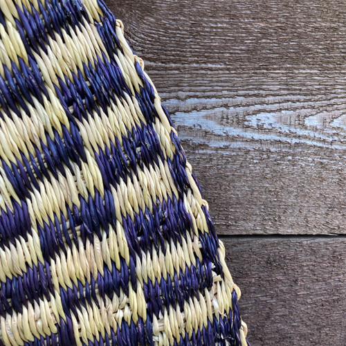 This floor mat is handwoven in Ghana from Elephant grass.