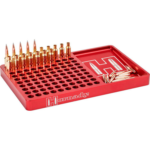 Hornady Aluminum Reloading Block, red metal reloading tray with multiple slots for holding ammunition and bullets, includes additional compartments for small parts.