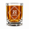 Whiskey-filled heavy-base rocks glass with frosted J&J Designz lettering inside overlapping diamond outlines, shown against white.