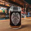 Custom etched Police Officer badge on a premium 16 oz Libbey glass, displayed on a wood bar top, perfect for law enforcement tribute gifts and collectibles