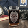 Custom etched Police Officer badge on a 16 oz Libbey can-style glass with personalized backside option, perfect for law enforcement gifts and collectibles