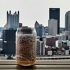 16 oz Custom Etched Pittsburgh Map Glass with a clear view of the city skyline, perfect for Pittsburgh-themed gifts or keepsakes.