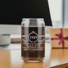 Personalized laser etched glass reads &quot;1949 Limited Edition Ralph Aged to Perfection.&quot; Filled with dark liquid and positioned on a desk with a computer monitor and a gift box in the background. Ideal for custom gifts, birthdays, and special occasions.
