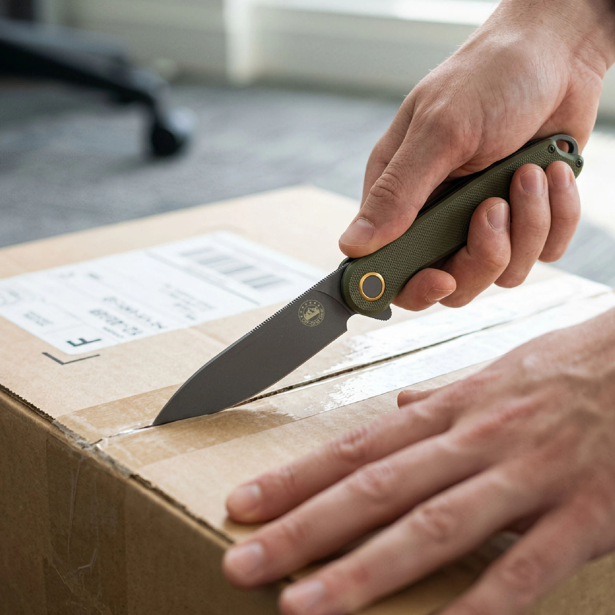 BaseLine Field Gray OD green G10 handle in hand