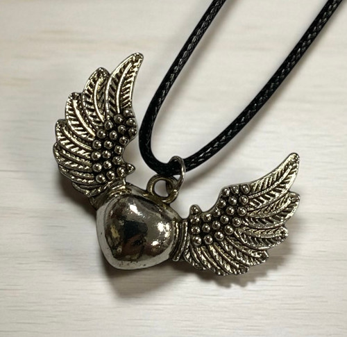 Antique silver winged heart pendant necklace on wax cord