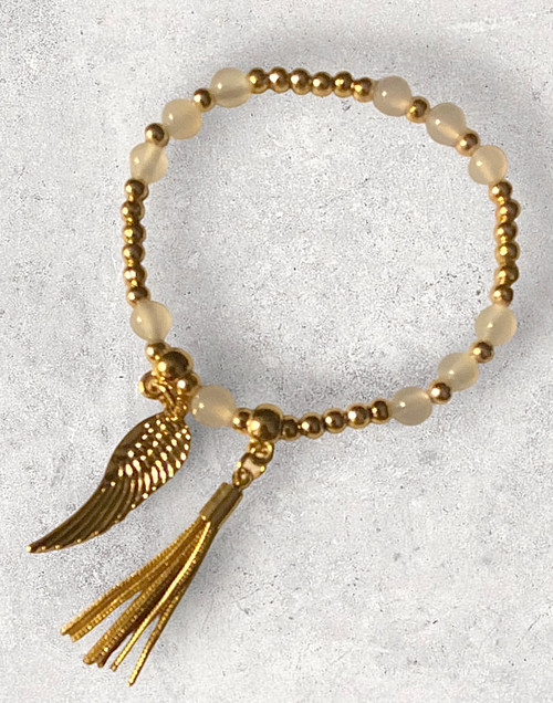 Gold alloy & cloudy white beaded stacker bracelet with angel wing & tassel charms