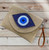 Evil eye beaded raffia sand straw bag with wristlet & crossbody strap - can be worn as crossbody bag or clutch