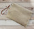 Evil eye beaded raffia sand straw bag with wristlet & crossbody strap - can be worn as crossbody bag or clutch