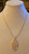 Elegant outline filigree petal necklace in gold alloy