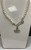 Faux pearl off white bead necklace with silver safety pin & Orb crystal charms