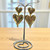 Large dangly burnished gold double heart stud post earrings 