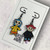 Button Eyed Coraline & Wybie Inspired Black Alloy & Enamel Odd Drop Dangly Earrings 