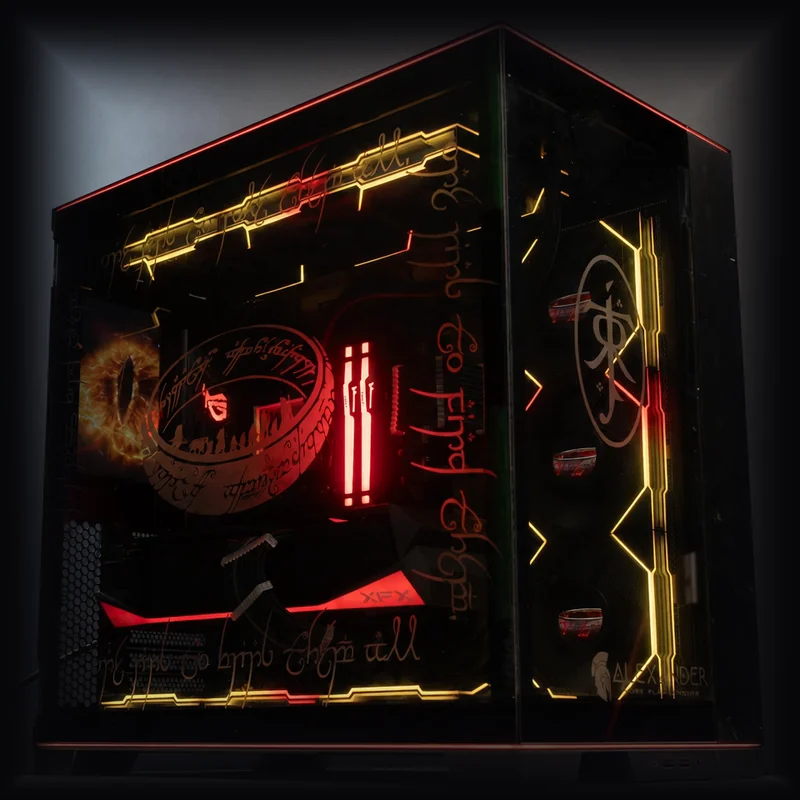 Alexander PCs Lord of the Rings themed custom build — the One Ring, Eye of Sauron, and Elvish script glowing in gold and red inside a black glass case