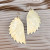 Fluff Hardware Spiked Winged Earrings