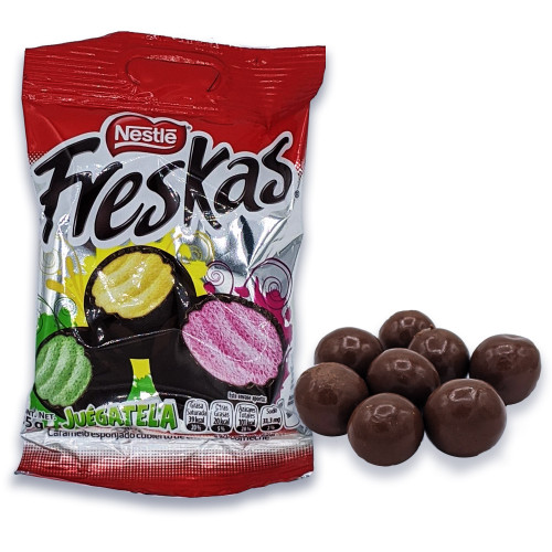 Nestle Freskas is a flavored sponge toffee balls covered in chocolate with a delicious center of pineapple, lime and strawberry flavored sponge toffee center. Nestle Freskas is a flavored sponge toffee balls covered in chocolate with a delicious center of pineapple, lime and strawberry flavored sponge toffee center.