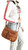 Locking Front Pockets Concealed Carry Purse. On model POV. Color: Brown