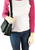 Small Multi-Pocket Crossbody Bag on model. Front POV. Color: Black