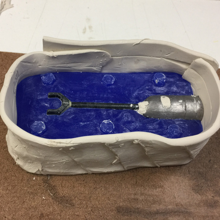 An example of the first half of the mould being prepared for pouring the second half.