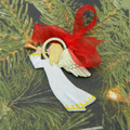 Christmas Angel blowing trumpet painted decoration.