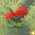 Christmas Robin Redbreast in holly painted decoration.