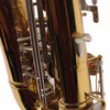Rear lower body detail showing the engraved serial-number area and silver-colored keywork. card