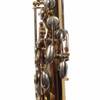 Rear body keywork with silver-colored levers and gold lacquered tubing. card
