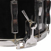 Close-up of Ludwig P85 snare strainer and chrome hardware showing surface wear and oxidation. card