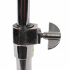 Close-up of Sonor-branded wing screw on the snare stand height adjustment collar, showing scratches and surface wear on the chrome finish. card