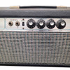 Close-up of the Normal channel showing dual inputs, Bright switch, Volume, Treble, Middle and Bass controls, with scratches on the silver control panel and wear along the grille cloth edge. card