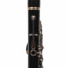 Rear view of the upper clarinet joint showing thumb key, tone hole, and surrounding keywork. card