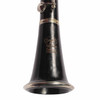 Close-up of the clarinet bell showing Signet Special Selmer branding and light surface marks. card