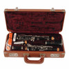 Disassembled Selmer Signet Special clarinet and accessories inside an open brown fitted case with burgundy lining. card
