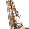 Close-up of Yamaha alto saxophone keywork with pearl touches and silver-colored keys. card