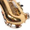 Close-up of the saxophone bow and lower keywork with visible fine scratches in the lacquer. card