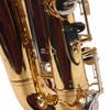 Close-up of lower rear Yamaha alto saxophone keywork and black thumb rest. card