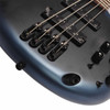 Close-up of the Ibanez SR500N bridge, individual saddles, control switches, and output jack.
