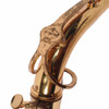 Close-up of the neck brace engraved “Evette Buffet Crampon,” showing heavy lacquer loss, scratches, and darkened wear across the brace and neck. card