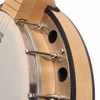Close-up of banjo rim showing metal tension hardware, circular openings, and natural wood construction. card